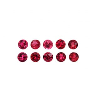 May include: Ten round, vibrant red gemstones are arranged in two rows against a white background. The gems have a polished, reflective surface, showcasing their rich color and clarity. These gemstones are suitable for jewelry making.