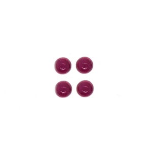 May include: Four small, round, magenta-colored buttons arranged in a square formation. Each button features a smooth, glossy surface with a slightly domed shape and a centered indentation, presenting a uniform appearance across all four individual pieces.