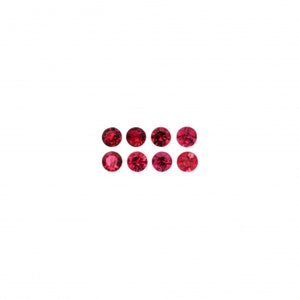 May include: Eight round, faceted, deep red gemstones arranged in two rows of four against a white background. The gems have a brilliant cut, reflecting light. The stones are likely rubies or garnets, perfect for jewelry making.