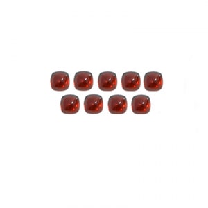 May include: Ten red, square-shaped glass gems. The gems are arranged in two rows of five.