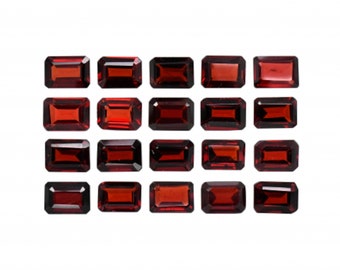 May include: A collection of 18 rectangular red gemstones, arranged in three rows of six. The gemstones are all the same size and shape, and they are set against a white background.
