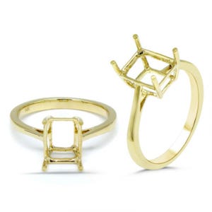 May include: A gold ring with a square-shaped setting for a gemstone. The ring is shown from two angles, one with the setting facing the viewer and the other with the setting facing away from the viewer.