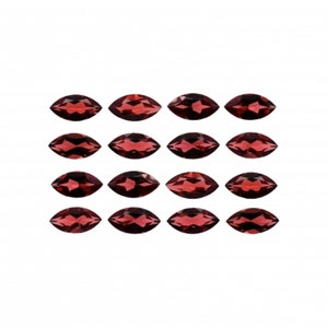 May include: A set of 16 maroon marquise-shaped gemstones. The gemstones are arranged in four rows of four, with each gemstone facing the same direction.