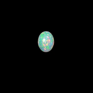 May include: A round, white opal gemstone with green, blue, and pink iridescent flashes.