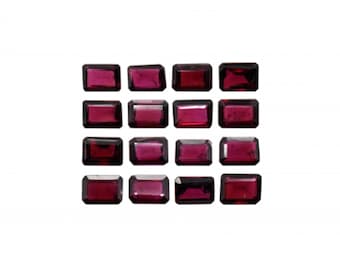 May include: A collection of 16 deep red rectangular gemstones, arranged in a grid pattern on a white background.