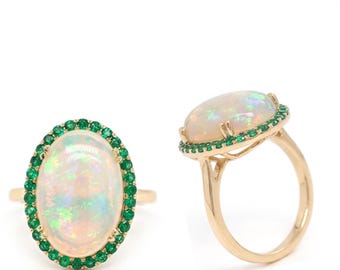 Ethiopian Opal Cab 6.08 Carat, Oval Halo Ring In 14K Yellow Gold with Emeralds (145832)