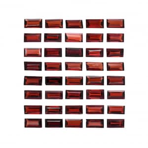 Może przedstawiać: Kolekcja 40 prostokątnych, czerwono-brązowych kamieni szlachetnych ułożonych w siatkę.