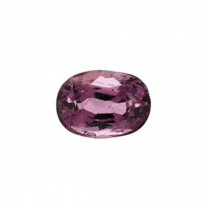 May include: A pink oval gemstone with a faceted cut.