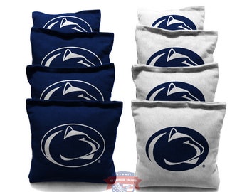 May include: Set of eight bean bags, four navy blue and four white, with a white Penn State Nittany Lion logo on each bag.  The bags are arranged in two stacks of four, with the navy blue bags on the left and the white bags on the right.