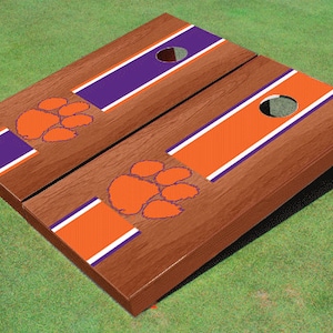 Clemson University Tigers Paw Rosewood Orange And Purple Alternating Long Stripe Cornhole Boards