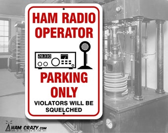 May include: White metal sign with red text that reads "Ham Radio Operator Parking Only Violators Will Be Squelched". The sign features a black and white illustration of a radio transceiver and microphone.