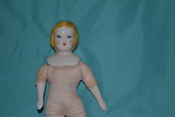 porcelain doll with cloth body