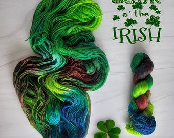 May include: Green, blue, and brown yarn skeins with a shamrock and the text "Luck o' the Irish".