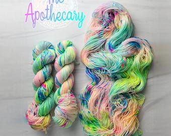The Alchemist - Hand-Dyed Variegated Yarn: dungeon Crawler Carl inspired DCC collection white neon and pastel rainbow glow under blacklight