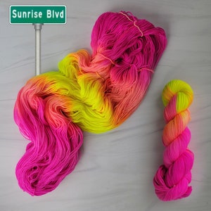 Sunrise Blvd - Hand Dyed Variegated Yarn - lace fingering worsted dk or bulky yarn- florescent fuchsia yellow neon glows in blacklight