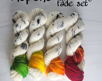Aspen fade set - assigned pooling 3 or 4 skein set on fingering or other yarn white with black speckles and pop of green yellow orange red