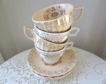 Set of 4 22k gold mismatched Teacup and Saucer Sets.  Alice in Wonderland Tea Party. Gold Gilt Floral China Dishes. Shabby Chic, Victorian