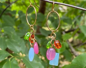 Handmade gold tone dangle drop earrings with glass beads in lime green, sky blue, orange and hot pink.