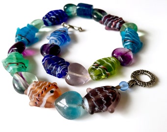Glass Fish Lampwork Swirl Beaded Statement Necklace. Blue Green Multi Colored Translucent Fish and Hearts Glass Beads.