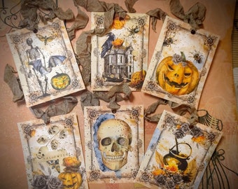 May include: Six Halloween-themed gift tags with various designs, including a skeleton, a skull, a pumpkin, and a cauldron. The tags are decorated with intricate details and have a vintage aesthetic.