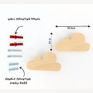 May include: Two wooden cloud-shaped wall hooks, each 6 cm tall and 10.5 cm wide, with mounting hardware. The image includes red wall mounting dowels and screws. The text reads "WALL MOUNTING DOWEL" and "HANDLE MOUNTING SCREW 6X25".