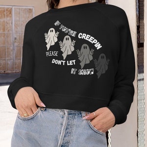 May include: Black cropped sweatshirt with a white graphic of four ghosts and the text "If you're creepin' please don't let it show."