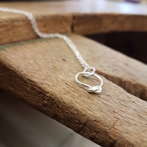 Contemporary sterling silver knot necklace