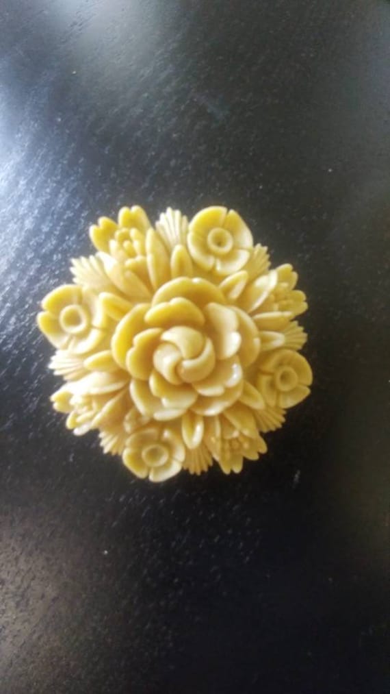 Vintage celluloid cream pin