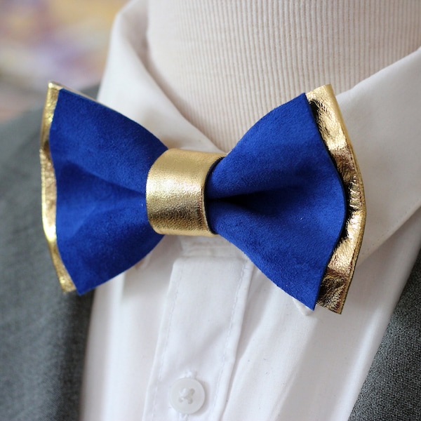 gold tie with blue suit