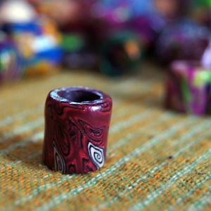 Winered, red & black spirals with black andwhite spirals polymer clay dreadbead