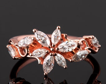 18k roségouden verlovingsring met bloemenmarquise diamanten