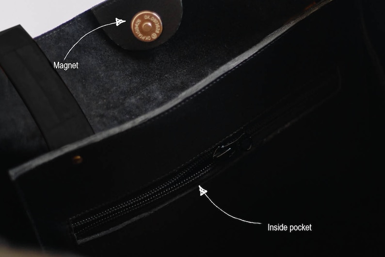 May include: Black leather tote bag with a zippered inside pocket and a magnetic closure.