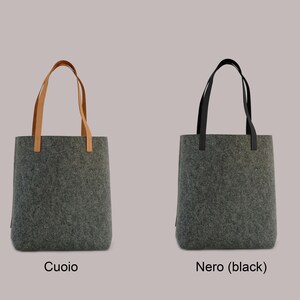 May include: Two gray felt tote bags with different handles. The bag on the left has brown leather handles, and the bag on the right has black leather handles. The bag on the left is labeled "Cuoio" and the bag on the right is labeled "Nero (black)".