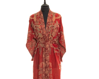 May include: A long red robe with a floral pattern and a tie belt. The robe is made of a soft, silky fabric.