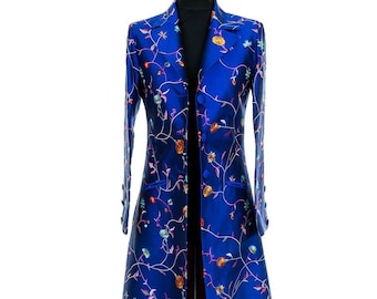 May include: A long, blue coat with a floral pattern. The coat has a single button closure and a long, flowing skirt.