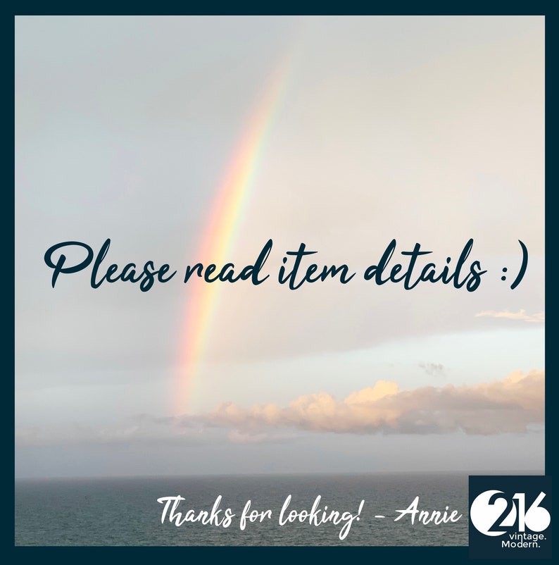 May include: A rainbow arches over a body of water with a cloudy sky. The text "Please read item details :)" is written in black cursive font. Below the rainbow, the text "Thanks for looking! - Anrie 216 vintage. Modern." is written in black cursive font.