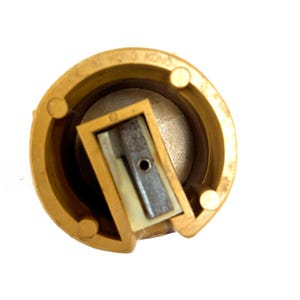 May include: A circular yellow plastic pencil sharpener with a central metal blade and a white plastic insert. The outer rim features embossed text that reads MADE IN HONG KONG. The sharpener has a hollow cylindrical body with internal supports.
