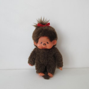 1980s. SekiguchiMonchhichiGirl Crying Face, Sucking Pacifier with Ribbon Monkey Doll16cm. Collectible Japanese Toy