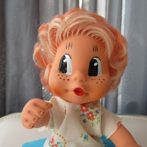 Vintage Late 60s DDR Rubber Doll Big eyes Movable head and arms Carrot strands of hair