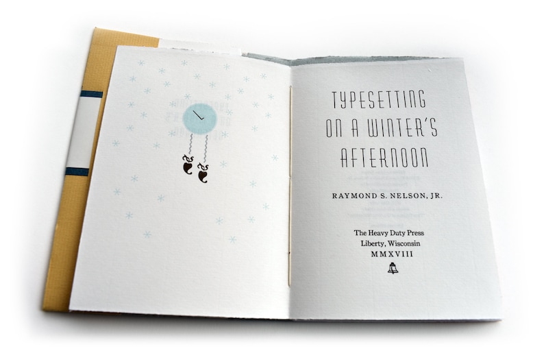 May include: A book titled "Typesetting on a Winter's Afternoon" by Raymond S. Nelson, Jr. The book cover features a blue clock with a pendulum and snowflakes on a white background.