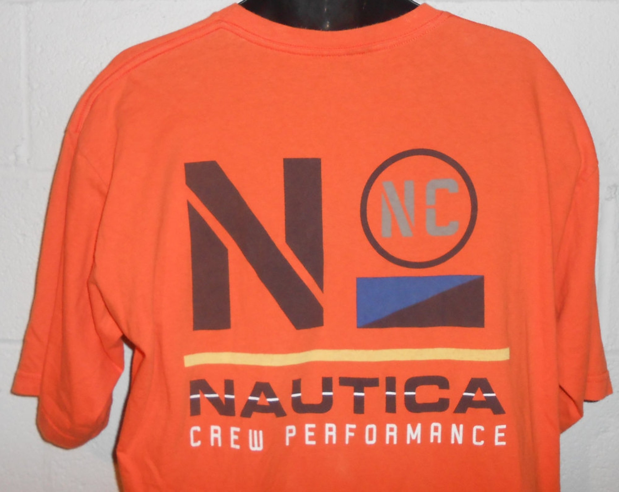 Discover Vintage 90s Orange Nautica Crew Performance T-Shirt