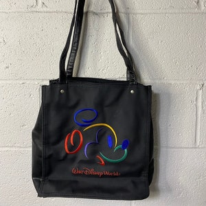 May include: Black tote bag with a colourful Mickey Mouse outline and the text "Walt Disney World."