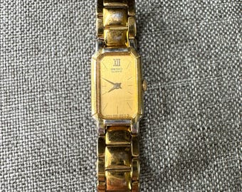 Vintage Seiko Quartz Japan 2E20 Base Metal St. Steel Back