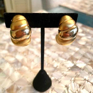 Givenchy gold toned clip on earrings