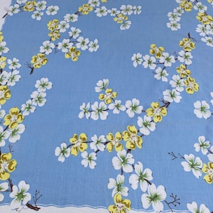 Vintage tablecloth. table Topper, Flower Blossoms yellow and white on a baby blue background. WOW!