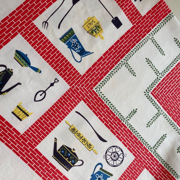 vintage tablecloth."Whats cooking Cookie"? Getting ready to start up the grill, pots and   pans and  condiments  abound.