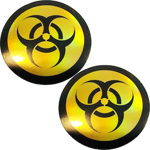 May include: Two round, black-rimmed stickers with a yellow, iridescent biohazard symbol in the center.