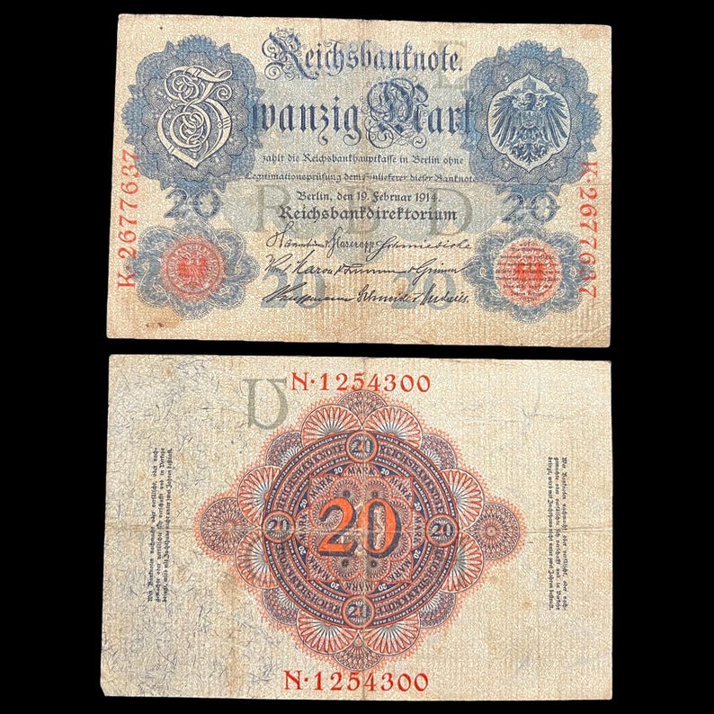 May include: Two antique German 20 Mark Reichsbanknote banknotes. The front features text in German, a large "20", and an eagle emblem. The back has a central "20" surrounded by ornate patterns and text. The banknotes are aged with visible wear.
