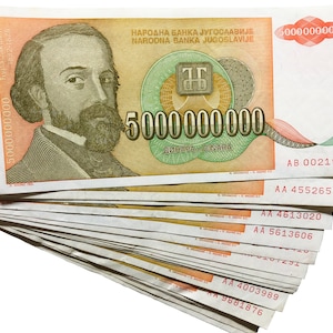 May include: A stack of 5,000,000,000 Yugoslav dinar banknotes featuring a portrait of Đura Jakšić, a Serbian poet, writer, and painter. The banknotes are dated 1832-1878 and have the text "NARODNA BANKA JUGOSLAVIJE" printed on them.