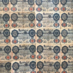 May include: A collection of vintage 20 Mark Reichsbanknote banknotes. The notes feature intricate designs with text, a central emblem, and the number 20. The notes have a beige background with blue, red, and black details.
